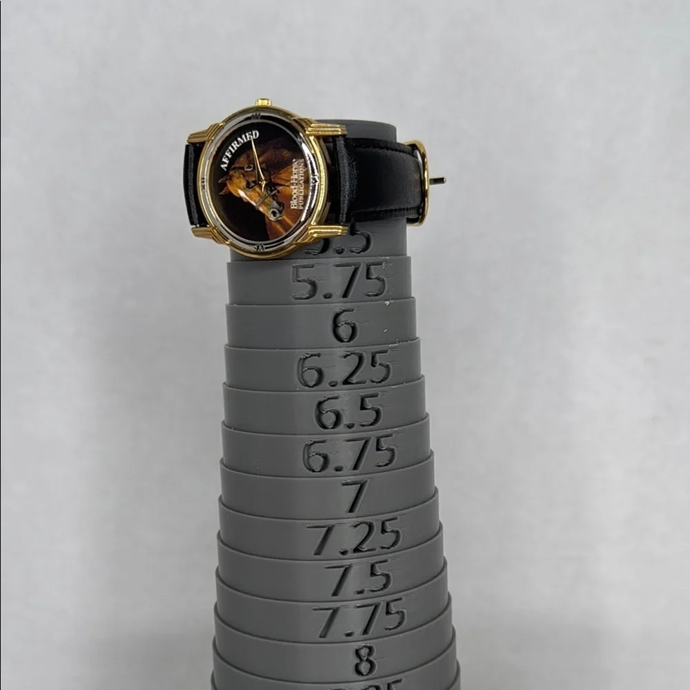 Vintage Affirmed Black and Gold Watch with Horse Design lot W2